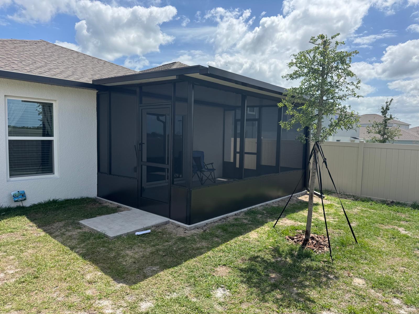 Custom black-framed screen room addition in the Tampa Bay area
